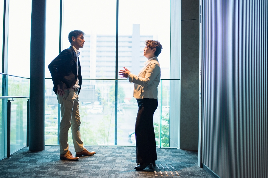 Emotional intelligence Two people talking with serious expressions