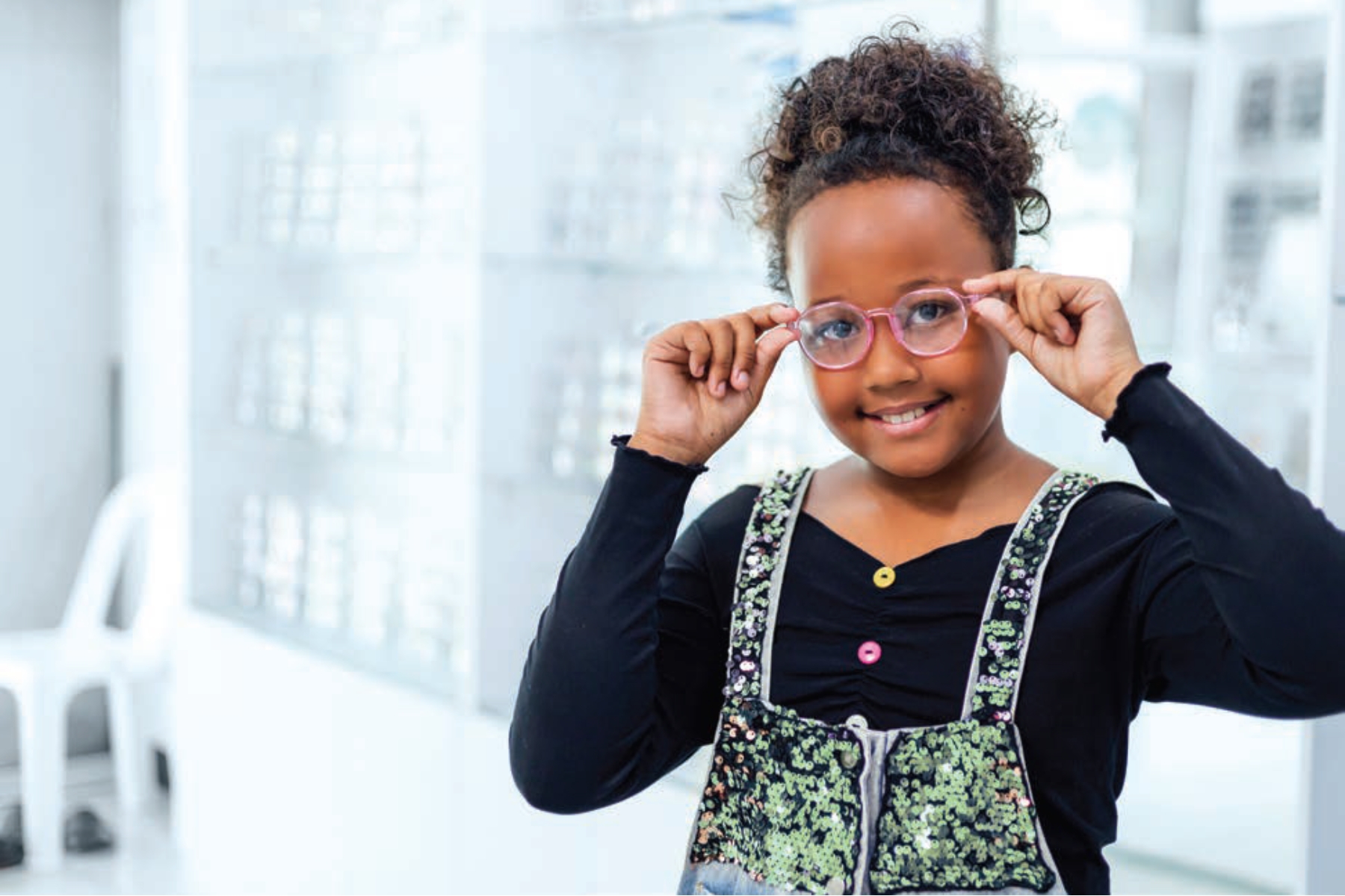Jade Bodzasy The A+ Method for Connecting with Kids in Clinic- feature image child trying on glasses